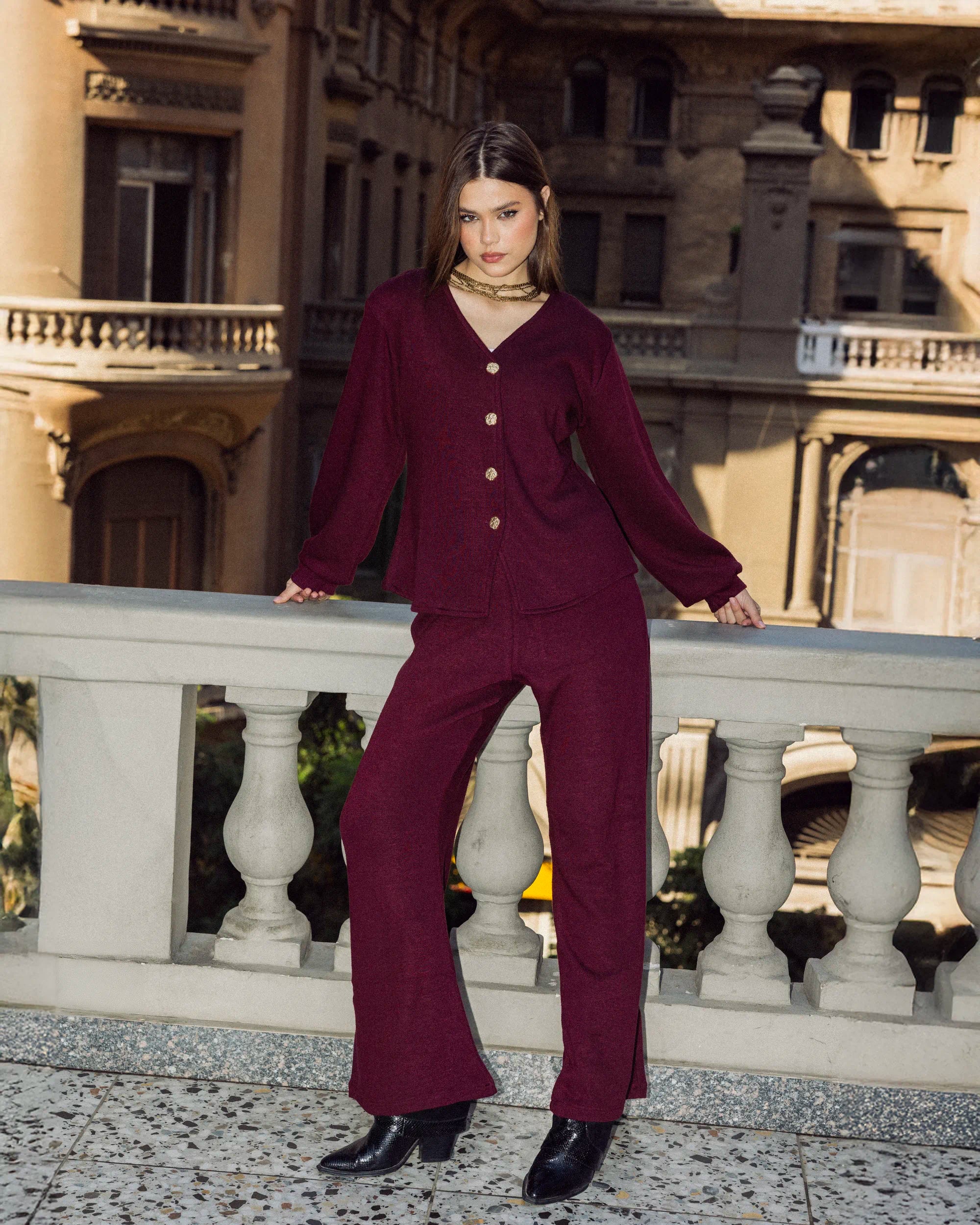 “Leaning pose of the burgundy Lounge Set highlighting its soft knit fabric and elegant relaxed fit.”