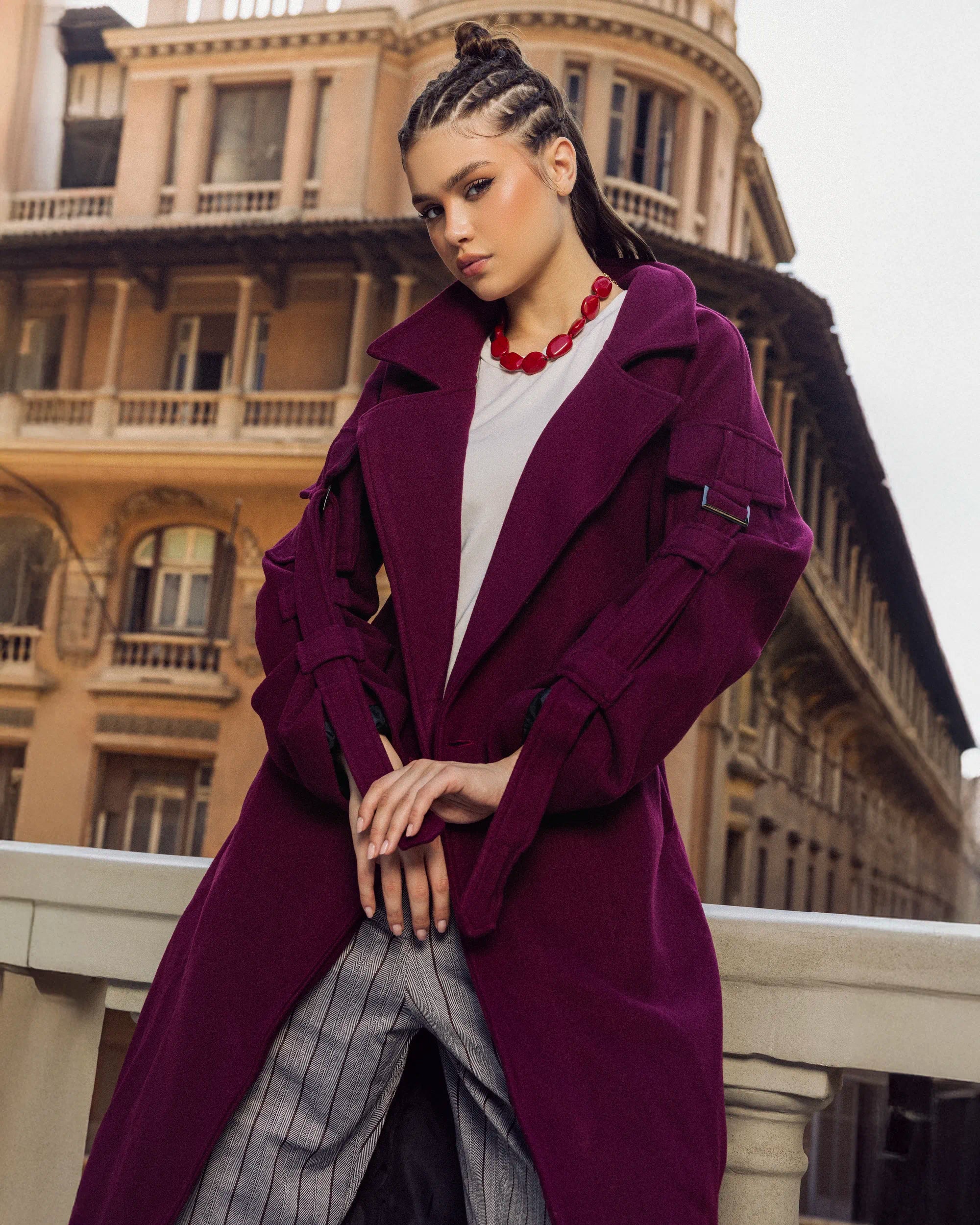 “Close-up front view of the burgundy Bound Coat showing the clean tailoring and wool texture.”