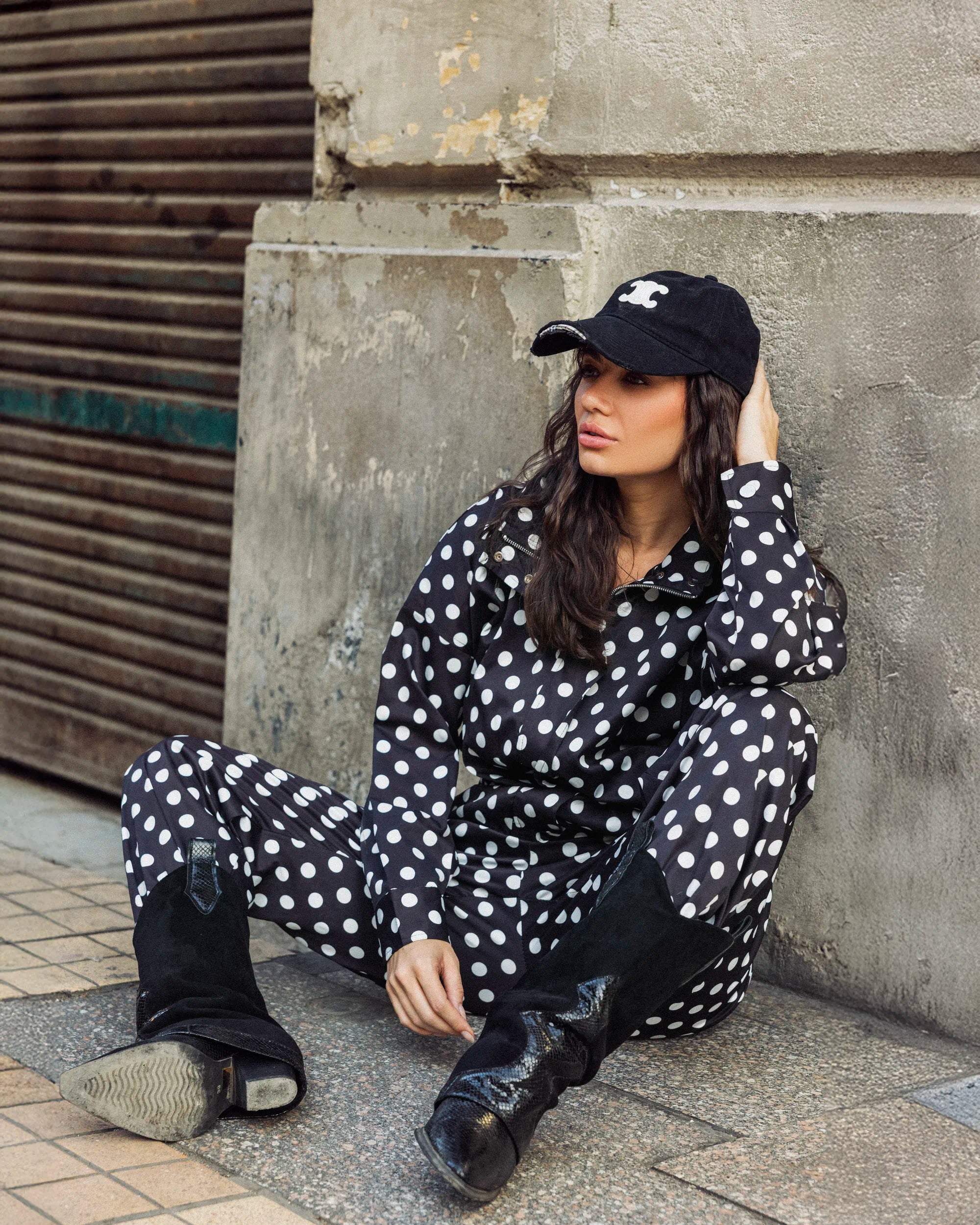 “Side-angle view of the black Polka Set showing the waterproof fabric and playful bold polka dots.”