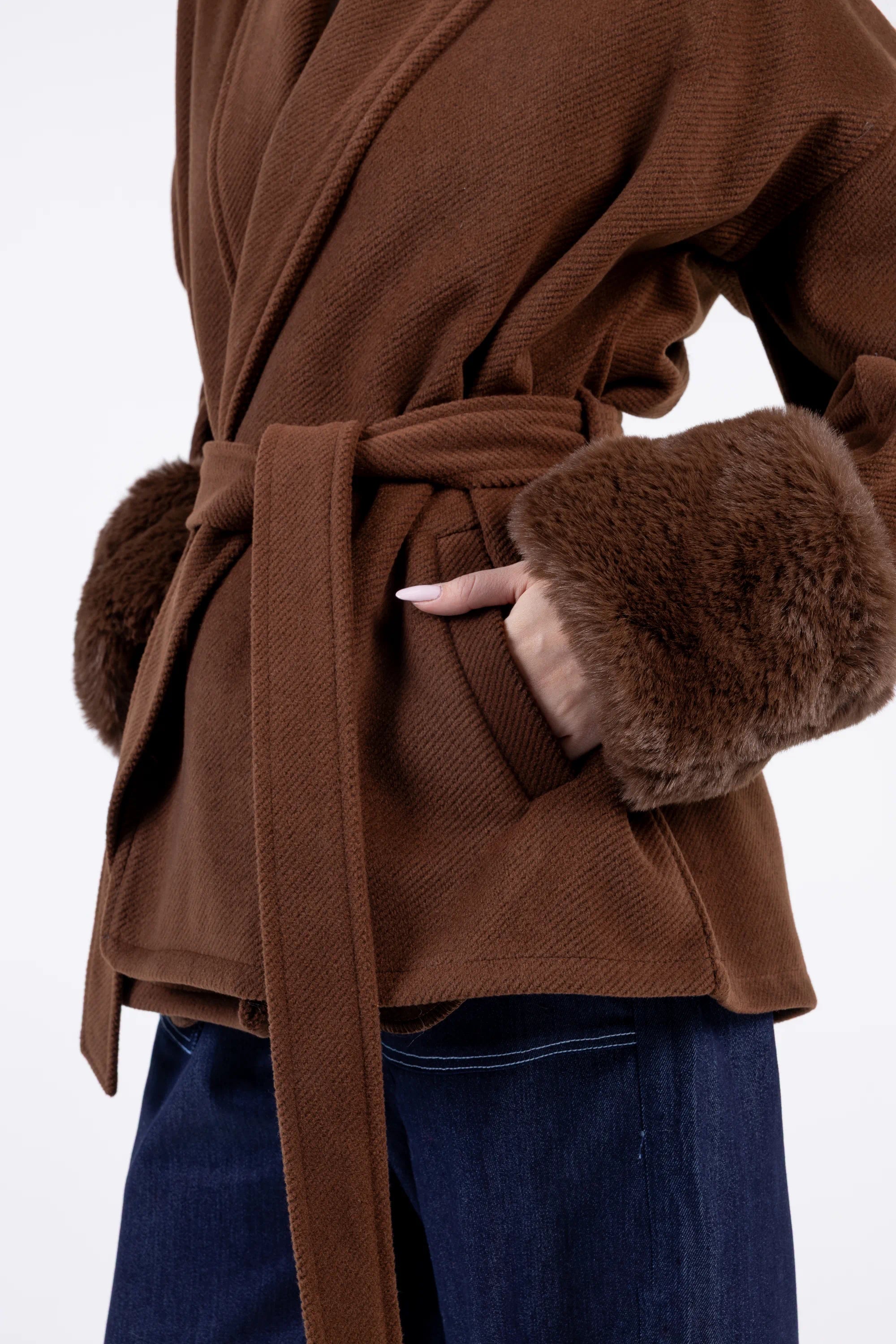 Brown coat with fur cuffs and waistband on a white background