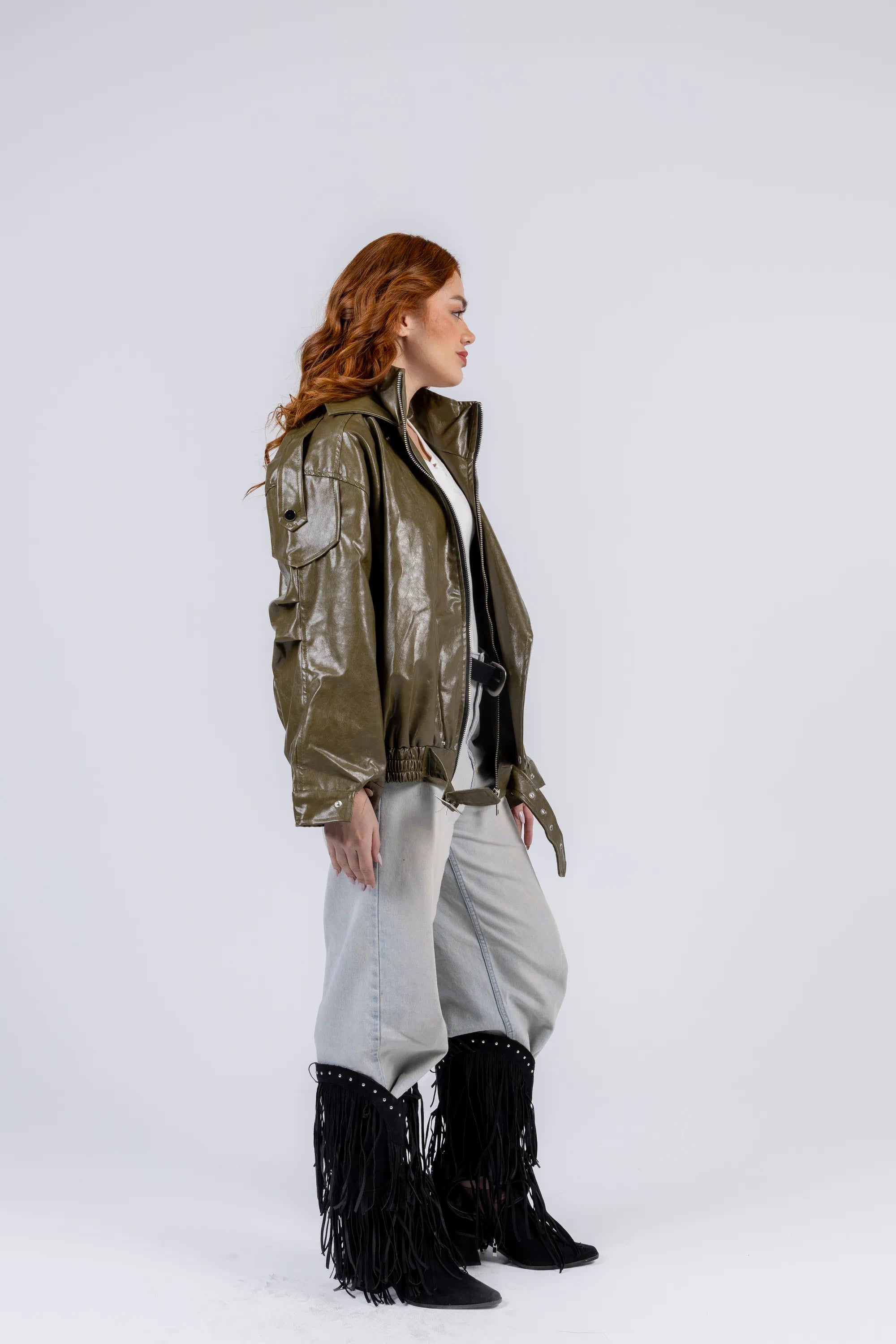 Person wearing a green jacket with a white background