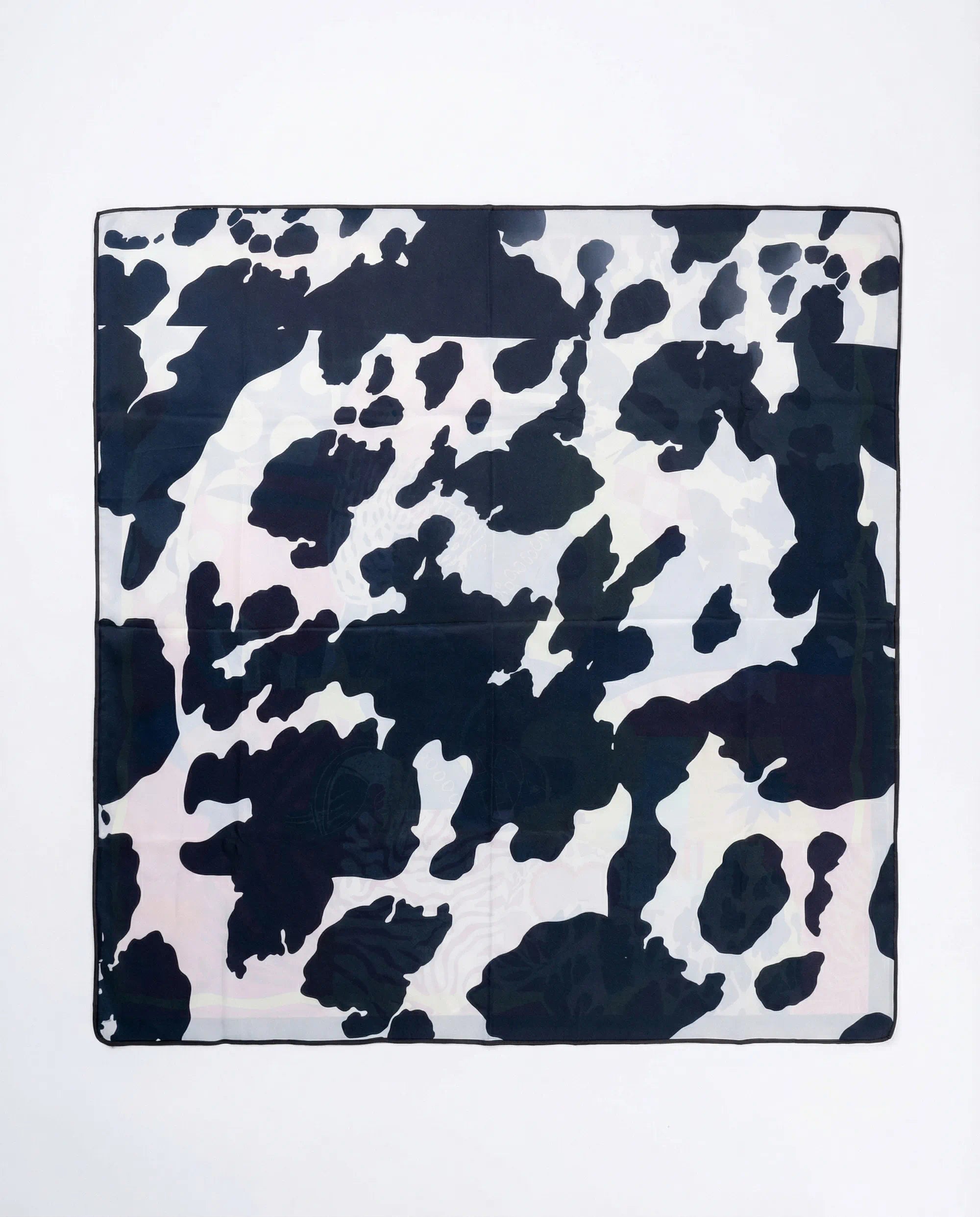Cow print pattern on a white background