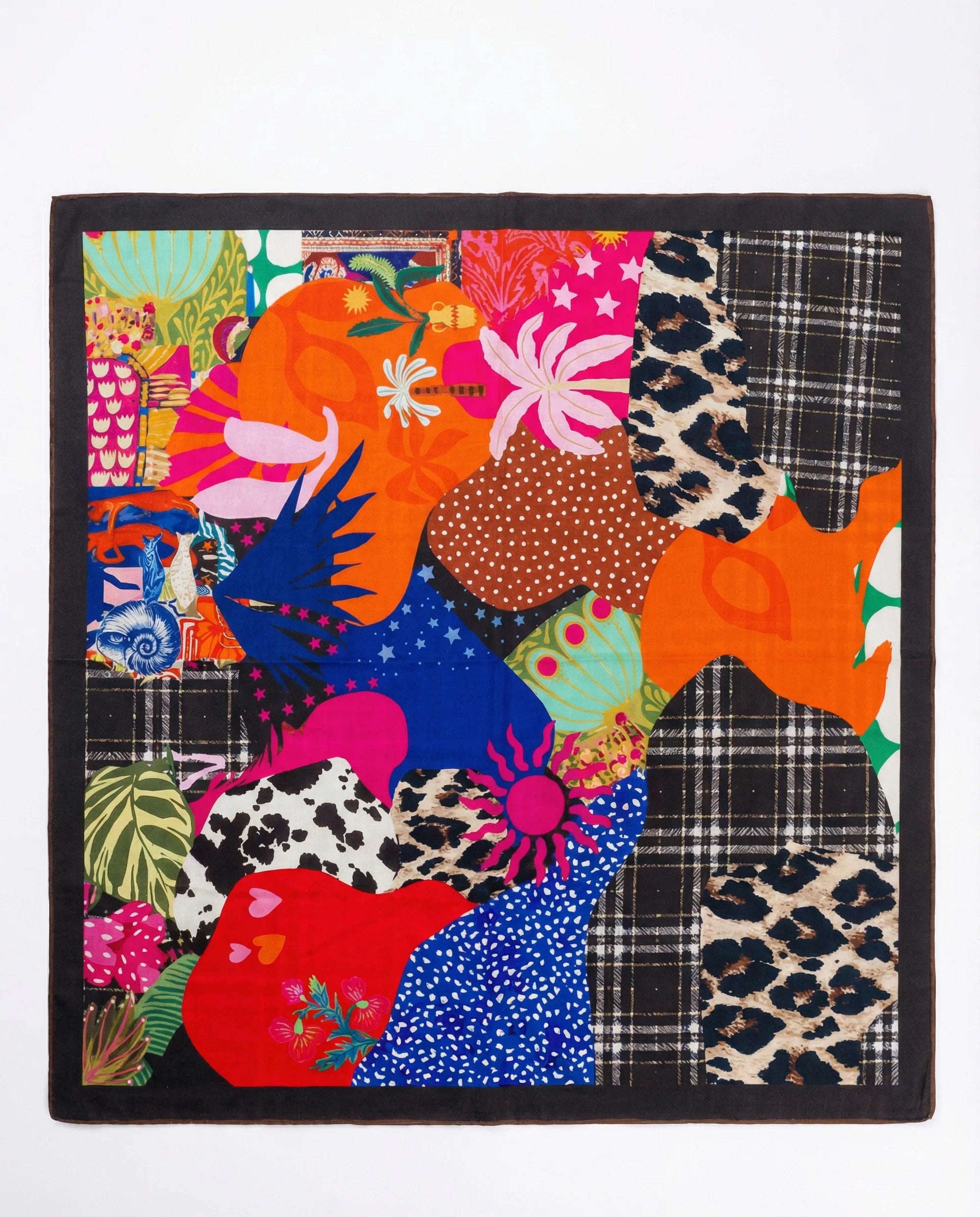 Colorful patchwork quilt with various patterns on a white background